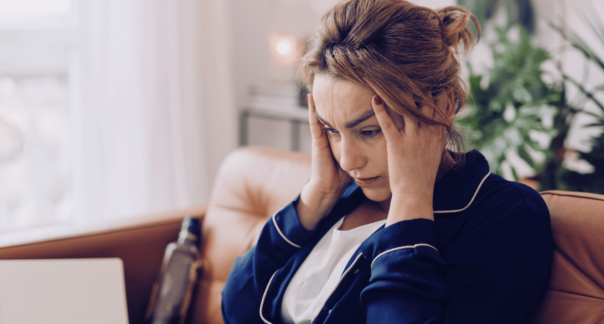 Frustrated woman staring at a laptop